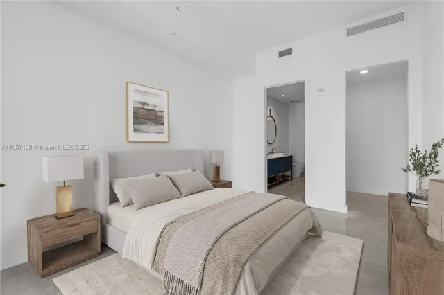 a bedroom with a bed and a couch