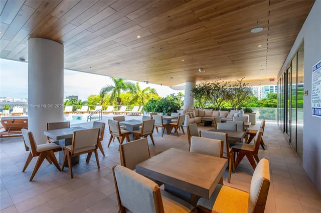 a view of swimming pool with outdoor seating