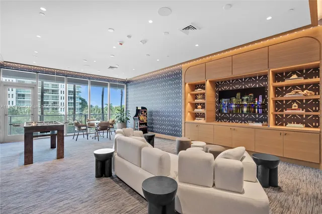 a room with lots of chairs and a table