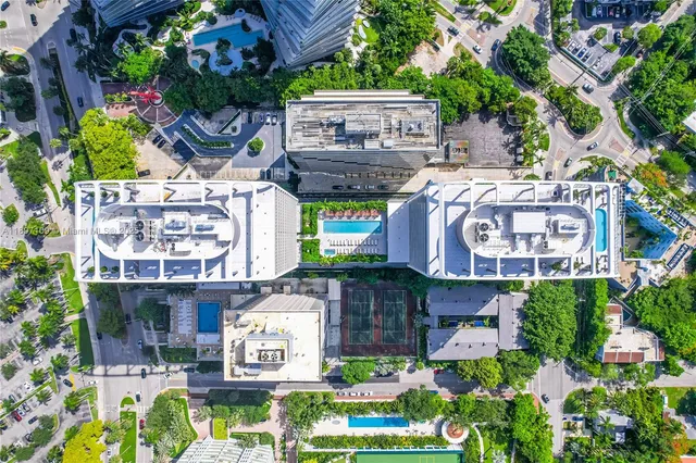 a view of a cafe with a table and a potted plant