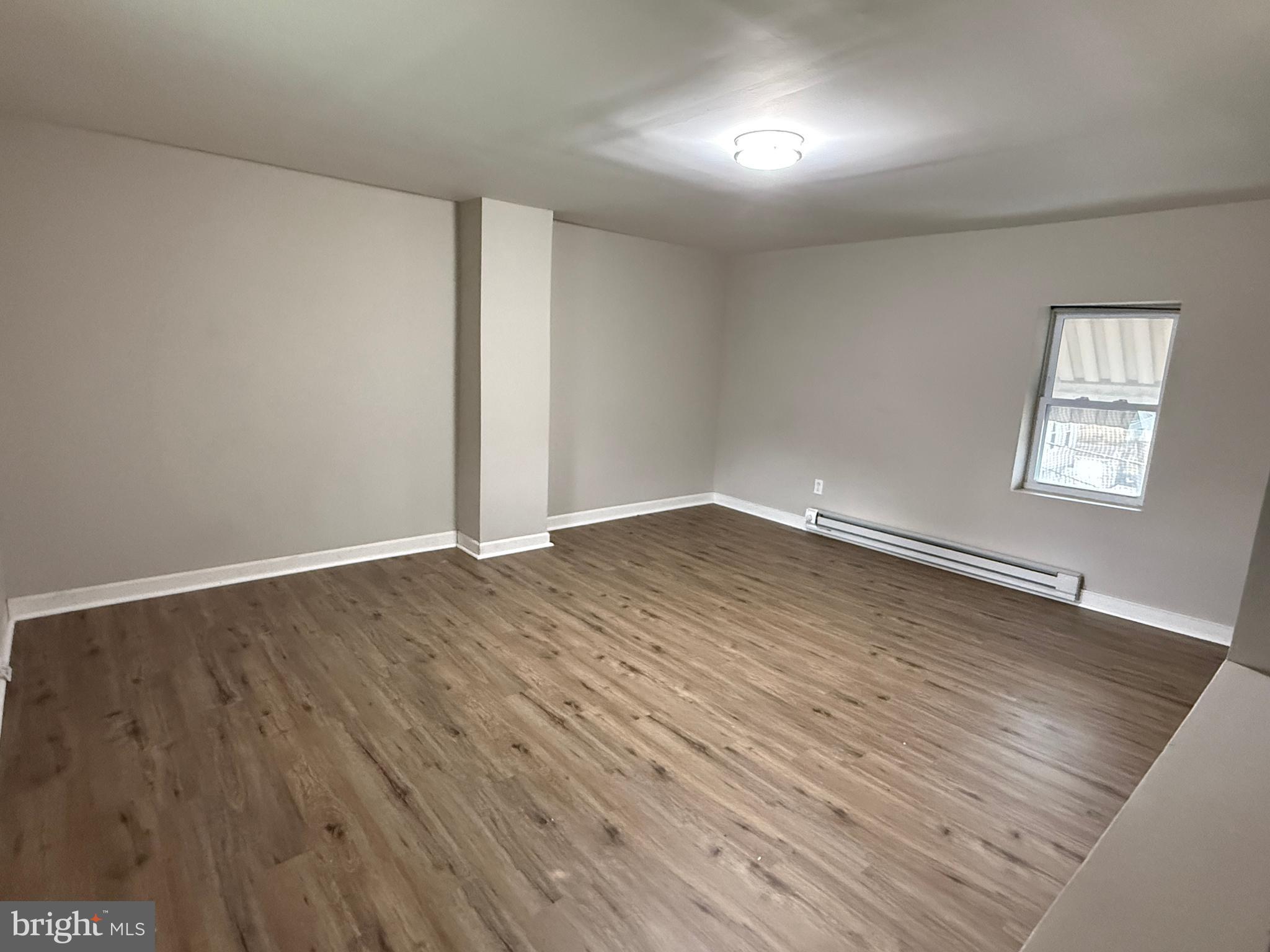 232 232-upper W Union Street Burlington, NJ 08016 - Photo 6 of 7 an empty room with wooden floor and windows