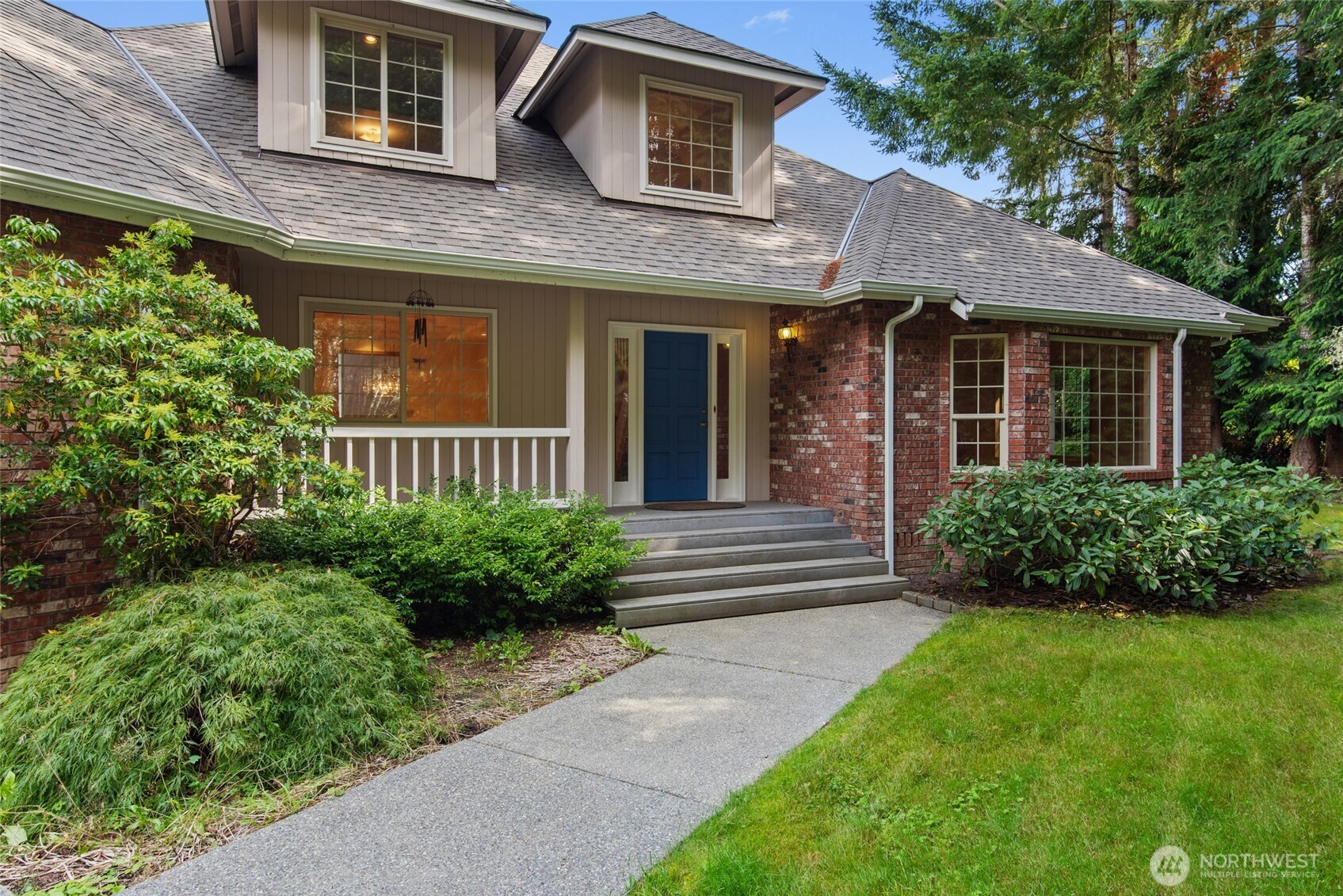 860 Hunt Road Port Angeles, WA 98363 - Photo 1 of 40 a front view of a house with a yard