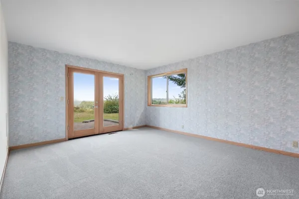 an empty room with windows