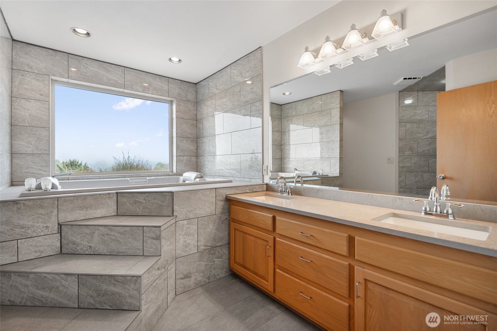 860 Hunt Road Port Angeles, WA 98363 - Photo 25 of 40 a bathroom with a double vanity sink and a mirror