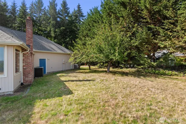 a view of a backyard of the house
