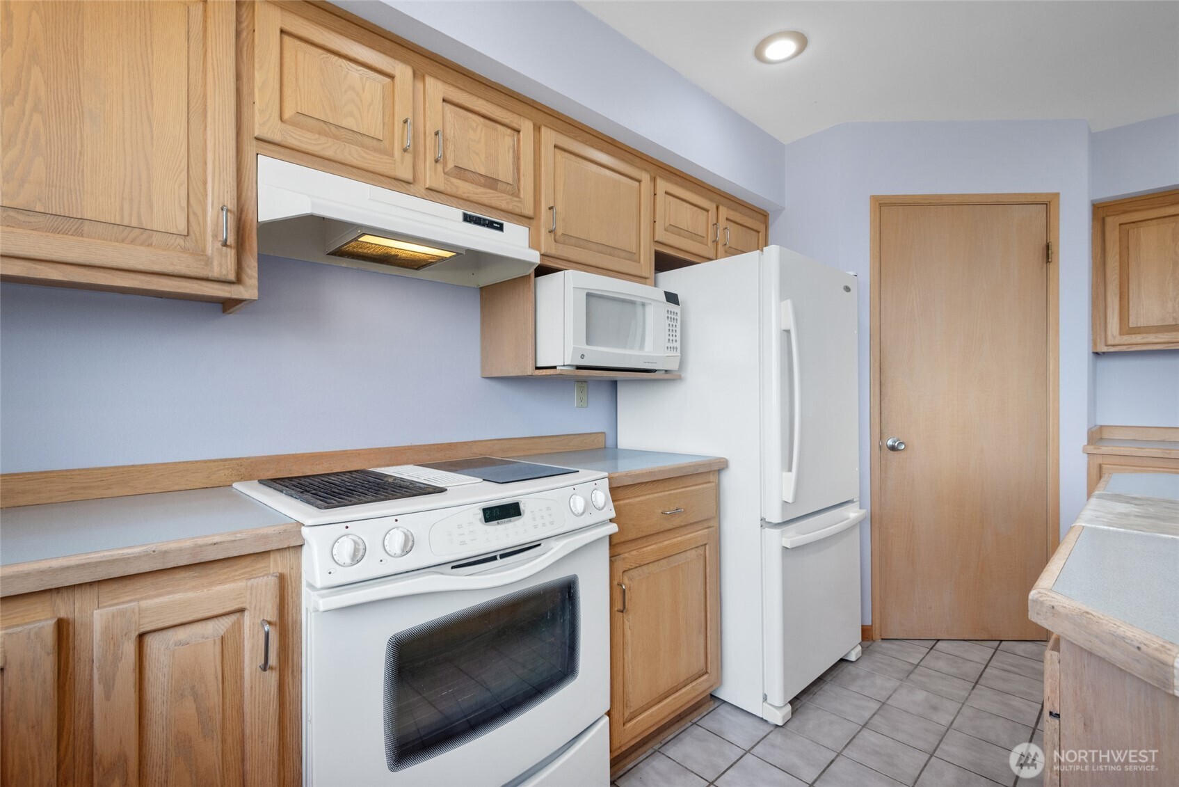 860 Hunt Road Port Angeles, WA 98363 - Photo 4 of 40 a kitchen with stainless steel appliances granite countertop a washer and dryer