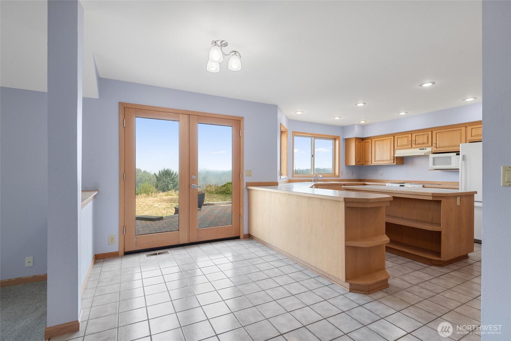 860 Hunt Road Port Angeles, WA 98363 - Photo 5 of 40 a kitchen with a sink and cabinets