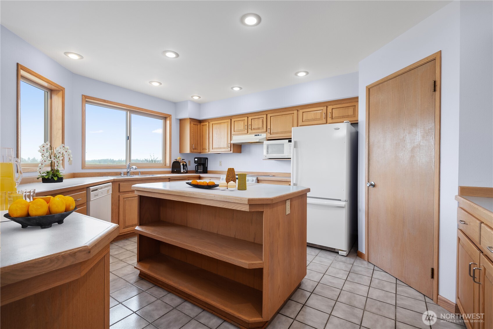 860 Hunt Road Port Angeles, WA 98363 - Photo 6 of 40 a kitchen with stainless steel appliances granite countertop a refrigerator a sink and a stove
