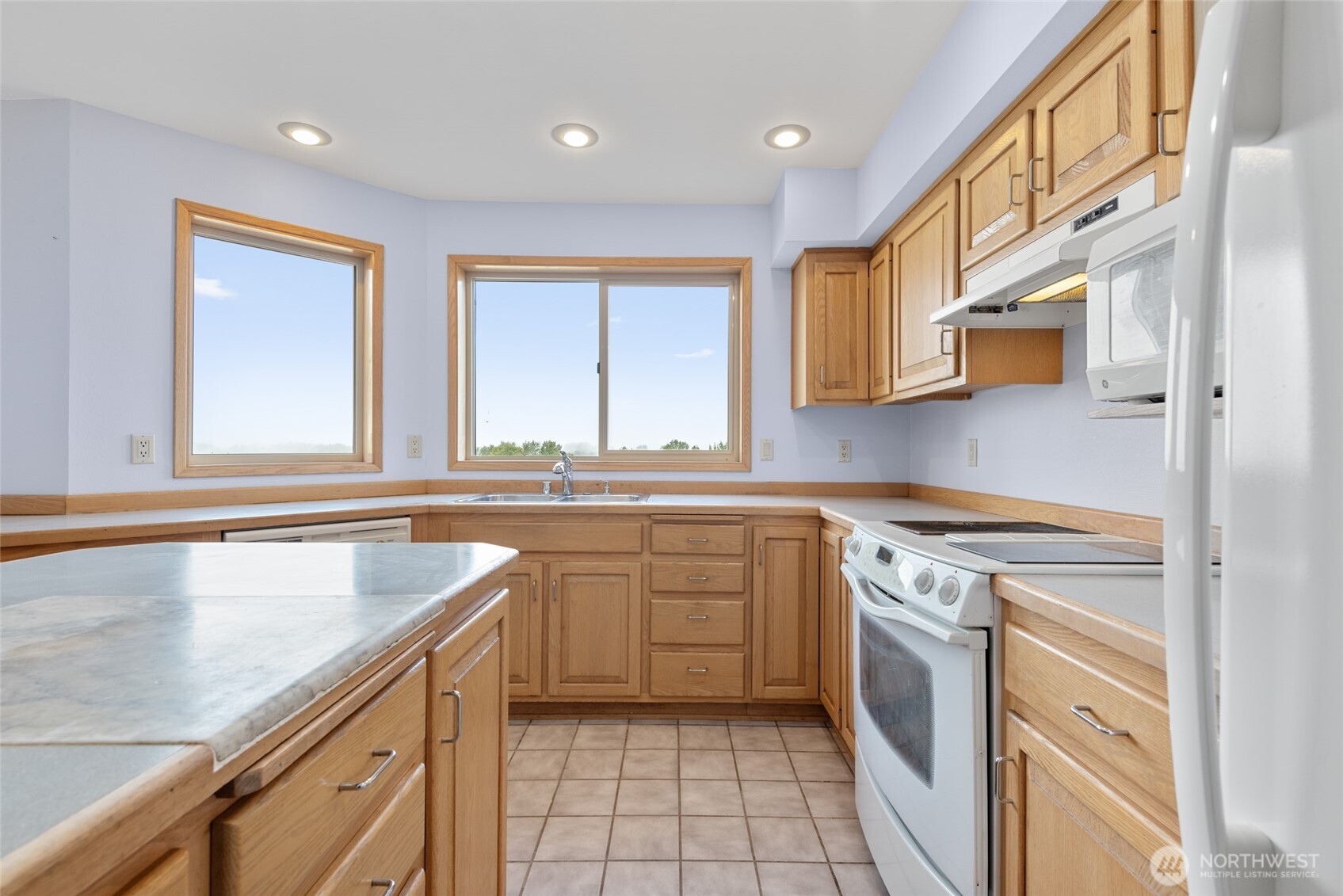 860 Hunt Road Port Angeles, WA 98363 - Photo 8 of 40 a kitchen with a sink stove and cabinets