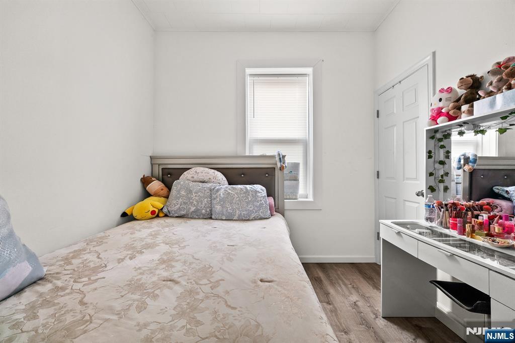 94 Center Street Clifton, NJ 07011 - Photo 12 of 38 a bedroom with a bed and a window
