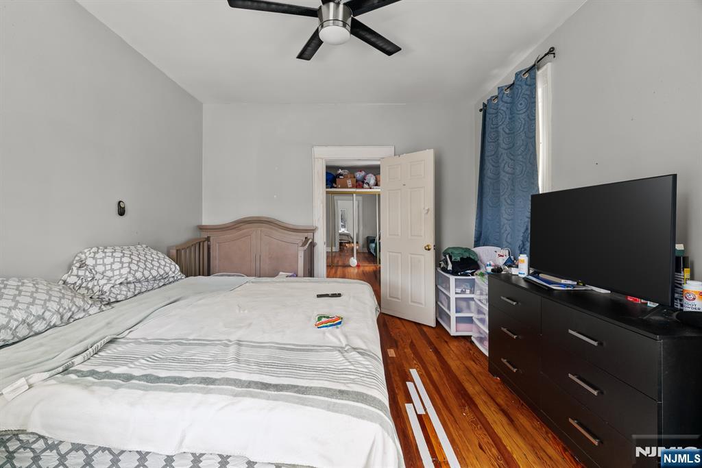 94 Center Street Clifton, NJ 07011 - Photo 25 of 38 a bedroom with two beds and a flat screen tv