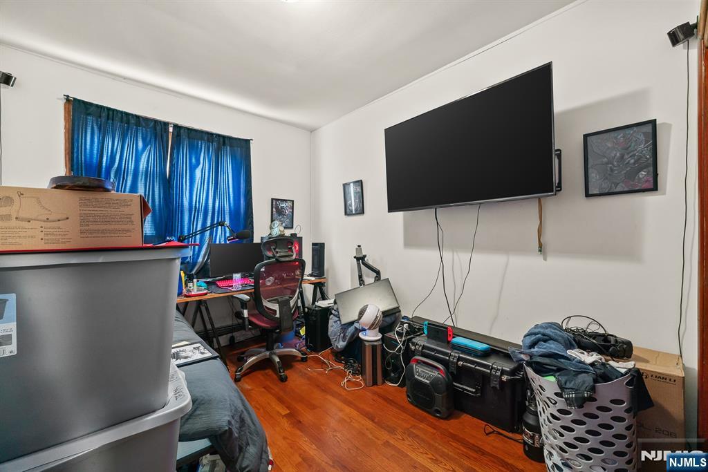 94 Center Street Clifton, NJ 07011 - Photo 5 of 38 a living room with furniture and a flat screen tv