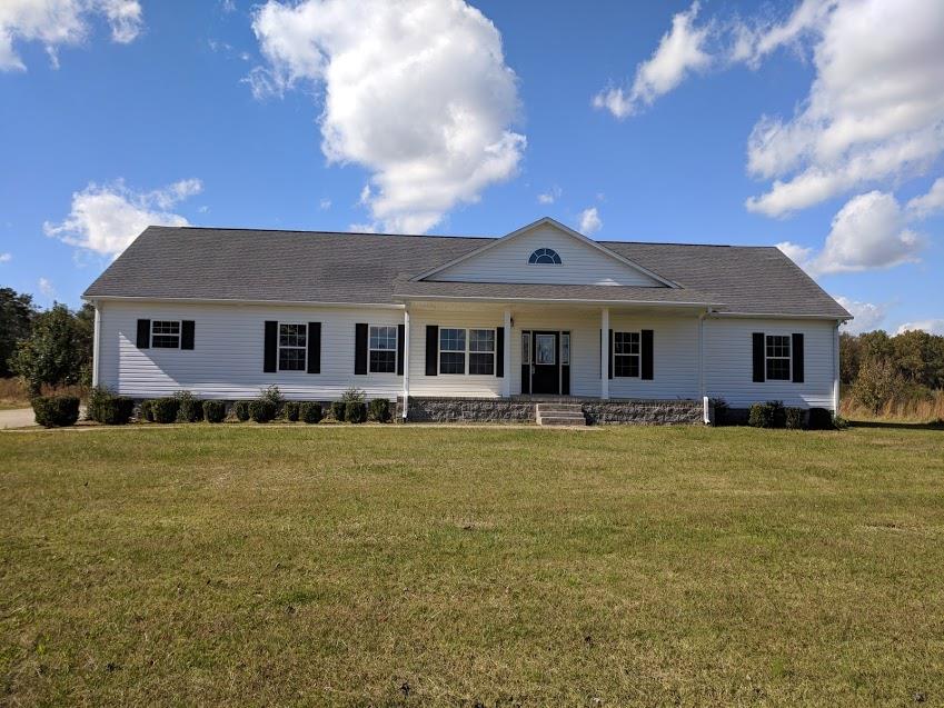 263 Elora Road Elora, TN 37328 - Photo 1 of 16 a front view of a house with a garden