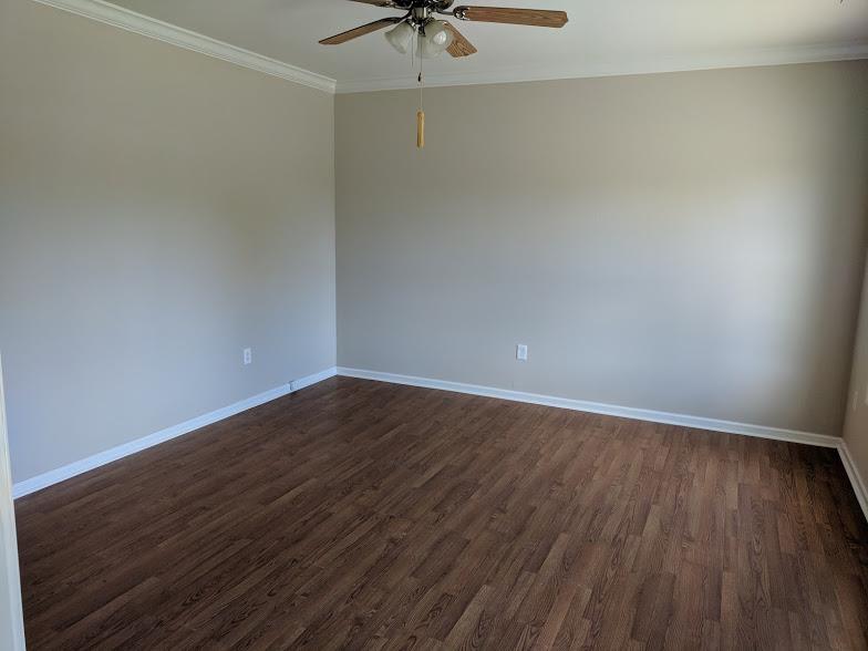263 Elora Road Elora, TN 37328 - Photo 12 of 16 a view of a room with wooden floor and a ceiling fan
