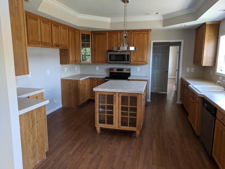 263 Elora Road Elora, TN 37328 - Photo 3 of 16 a kitchen with stainless steel appliances a stove sink and microwave