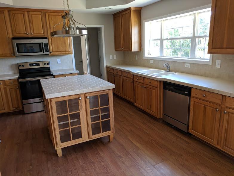 263 Elora Road Elora, TN 37328 - Photo 4 of 16 a kitchen with a stove a sink and a microwave