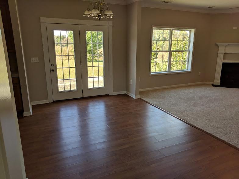 263 Elora Road Elora, TN 37328 - Photo 5 of 16 a view of an empty room with wooden floor and a window