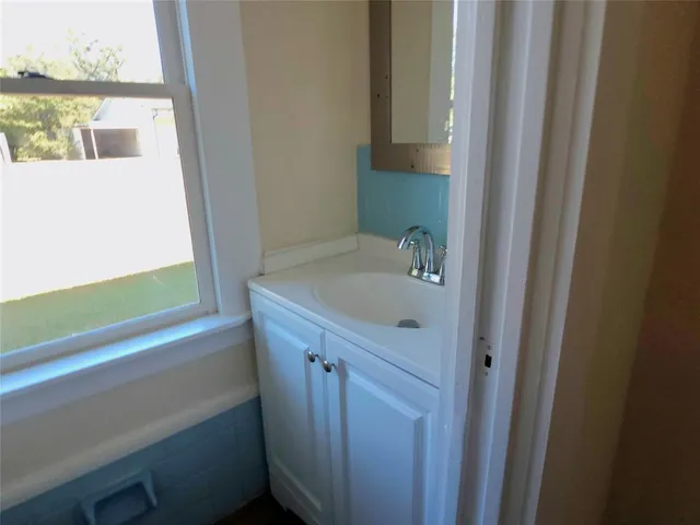 a bathroom with a bathtub and a sink