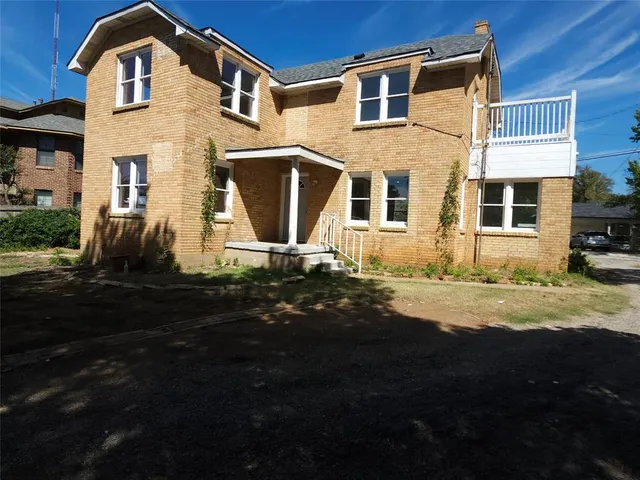 a front view of a house with yard