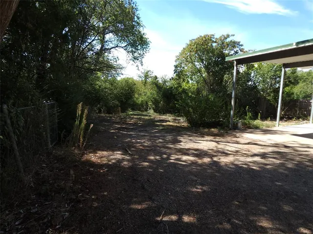 a view of outdoor space with deck and tree