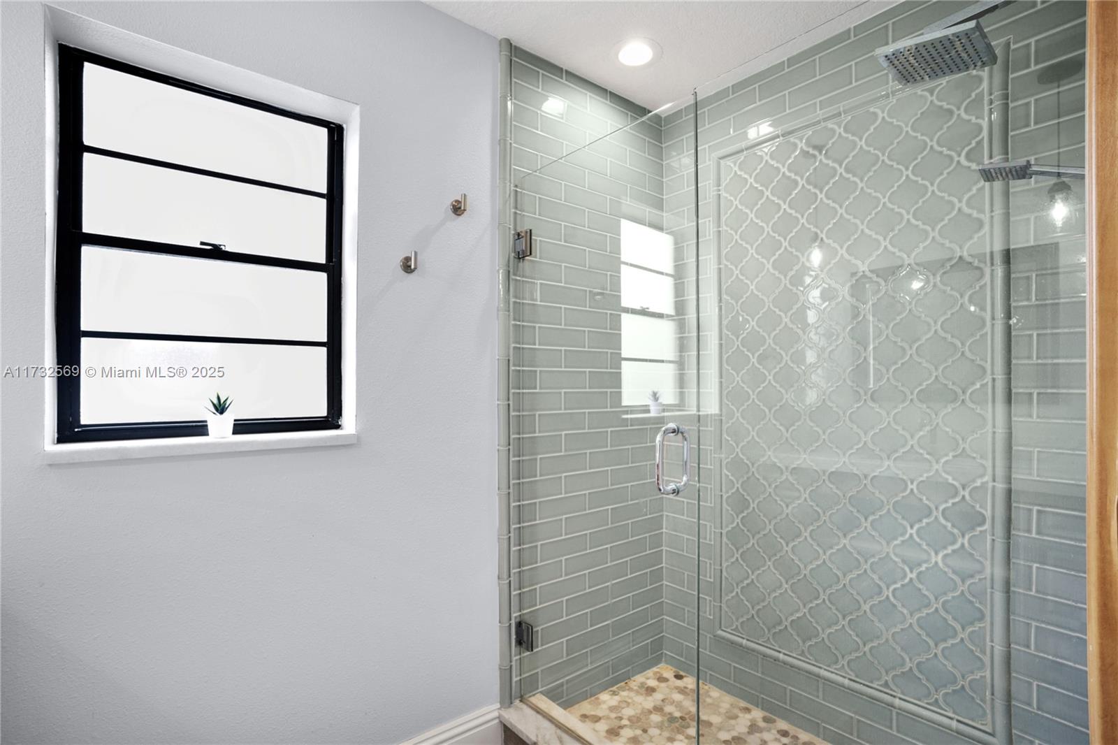 9635 Triton Court Boca Raton, FL 33434 - Photo 12 of 18 a bathroom with a shower and a sink