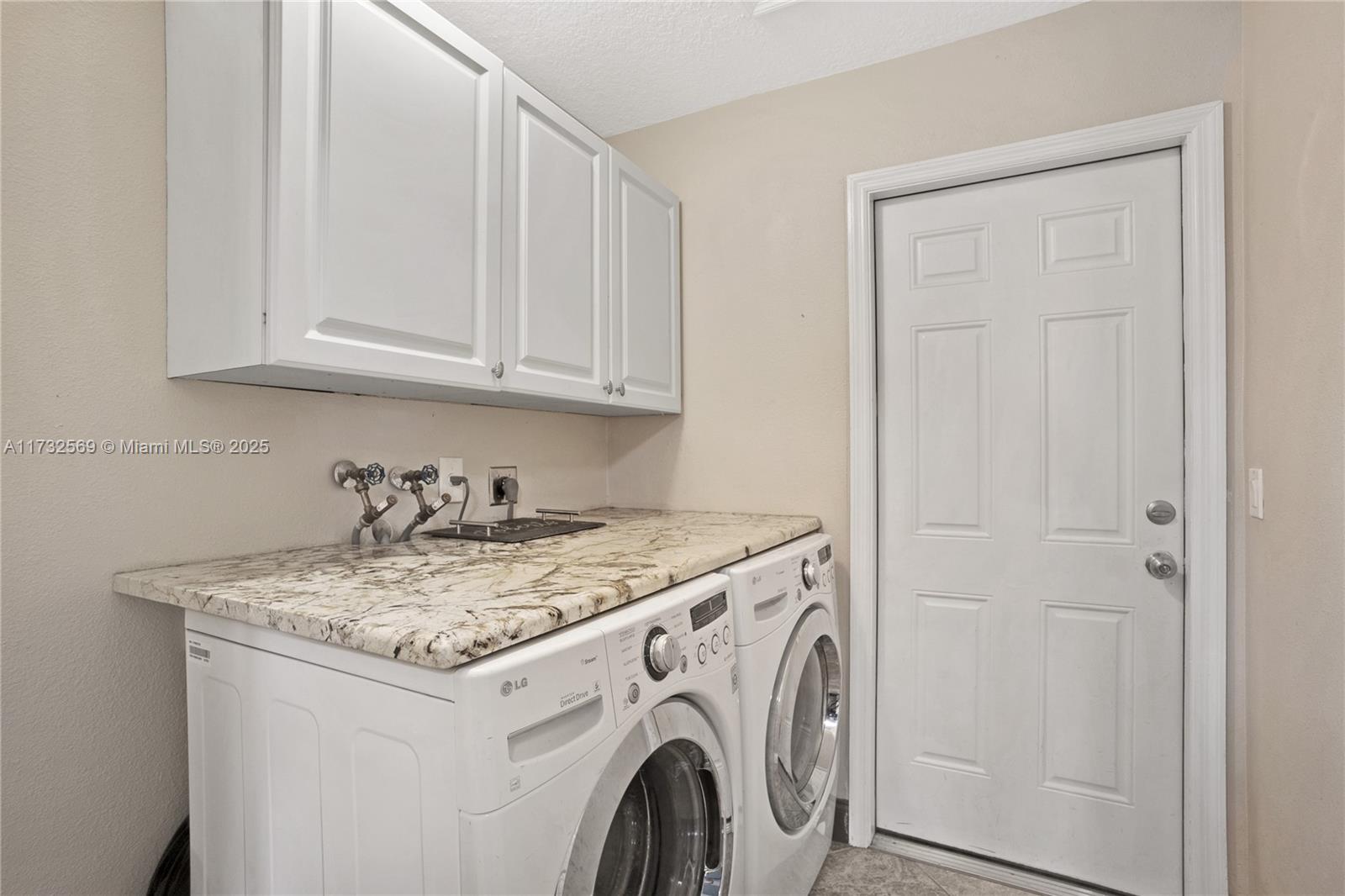 9635 Triton Court Boca Raton, FL 33434 - Photo 15 of 18 a utility room with dryer and washer