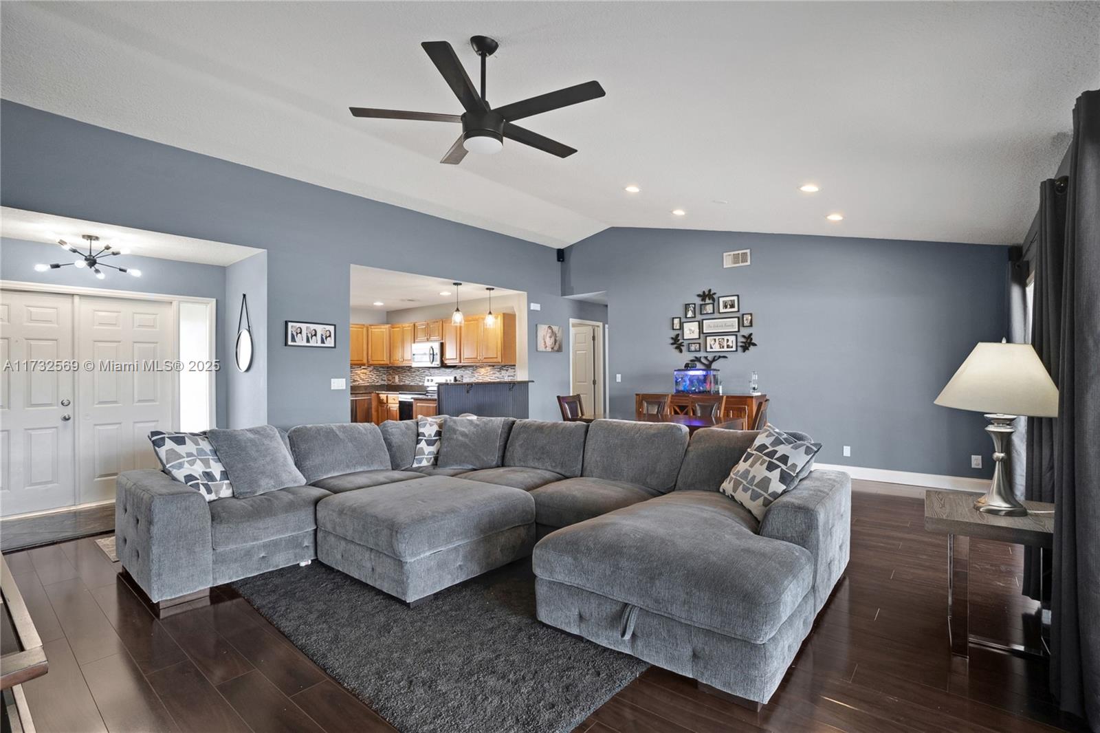 9635 Triton Court Boca Raton, FL 33434 - Photo 4 of 18 a living room with furniture and a large window