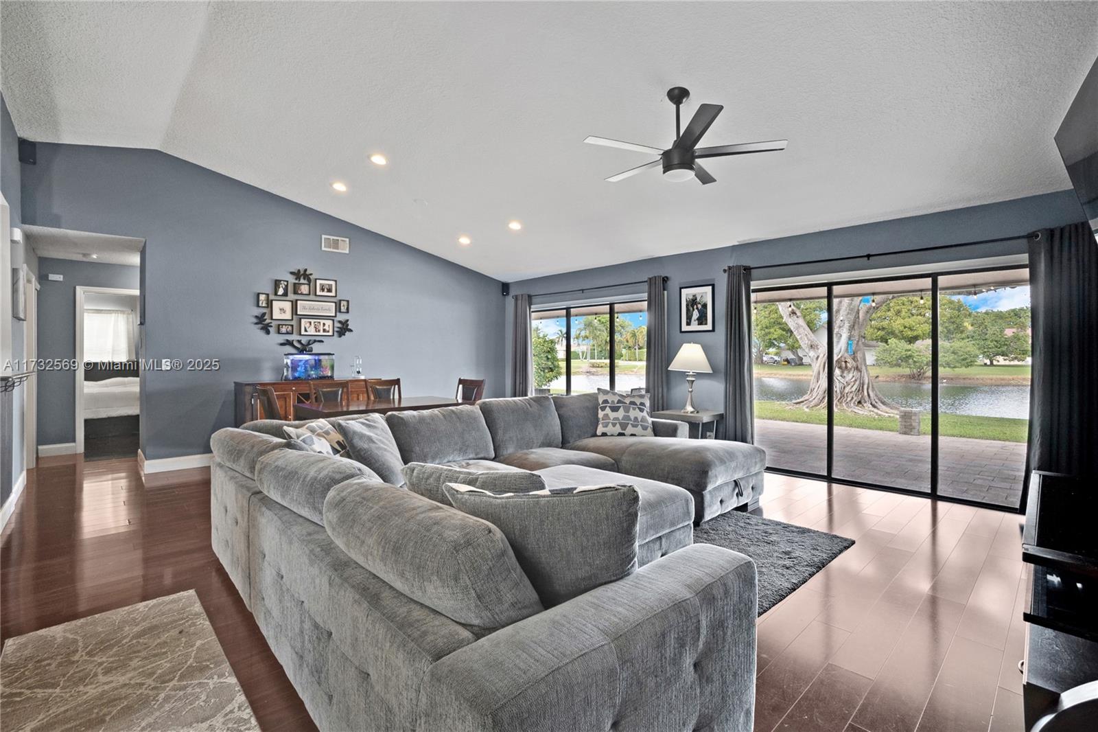 9635 Triton Court Boca Raton, FL 33434 - Photo 5 of 18 a living room with furniture and a large window