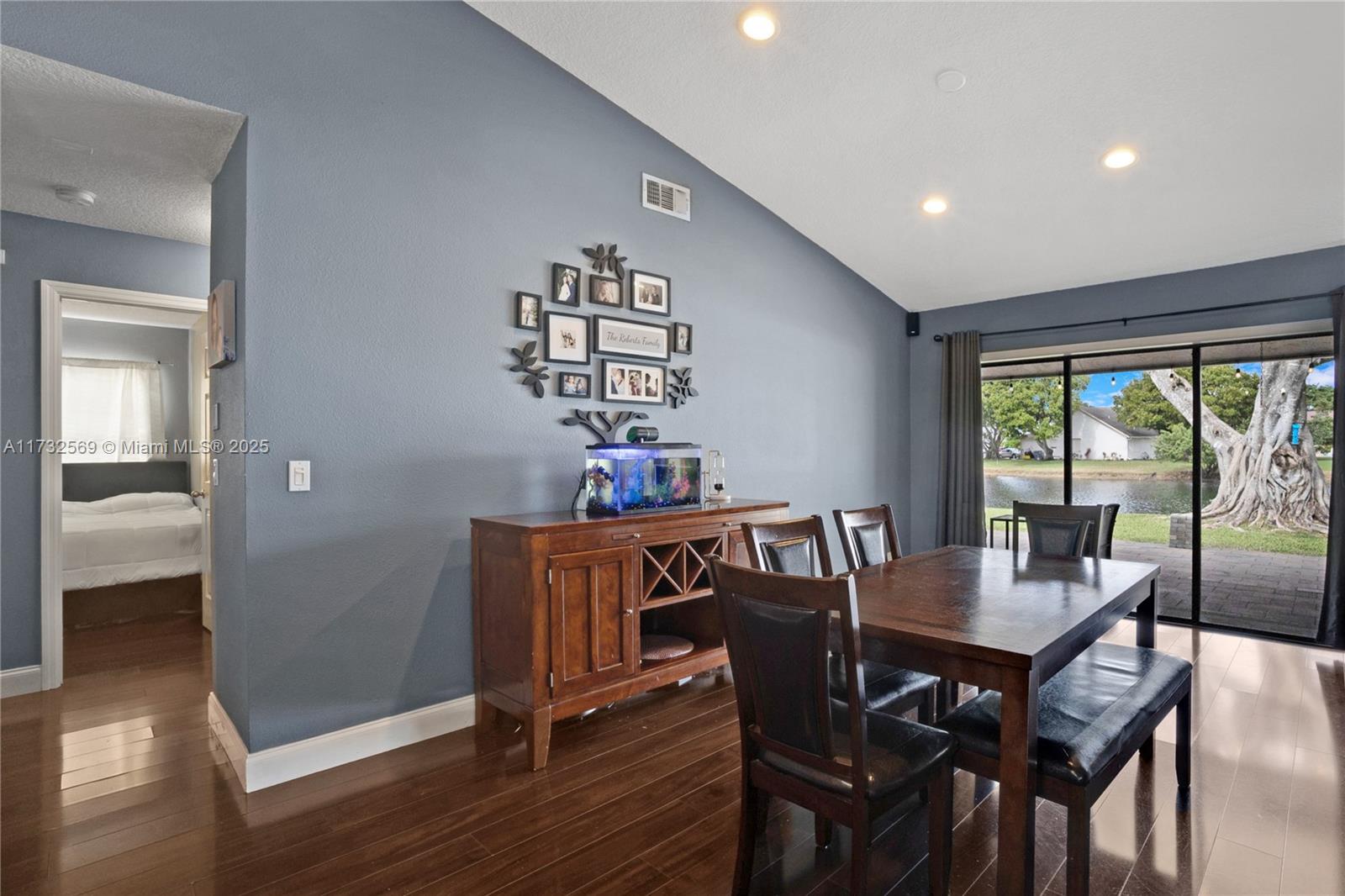 9635 Triton Court Boca Raton, FL 33434 - Photo 6 of 18 a view of a dining room with furniture window and wooden floor