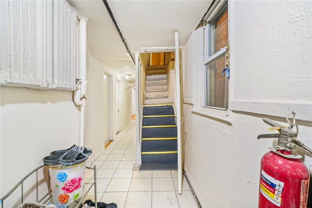 3022 Brighton 5th Street Brooklyn, NY 11235 - Photo 4 of 4 a view of an entryway with wooden floor and cabinets