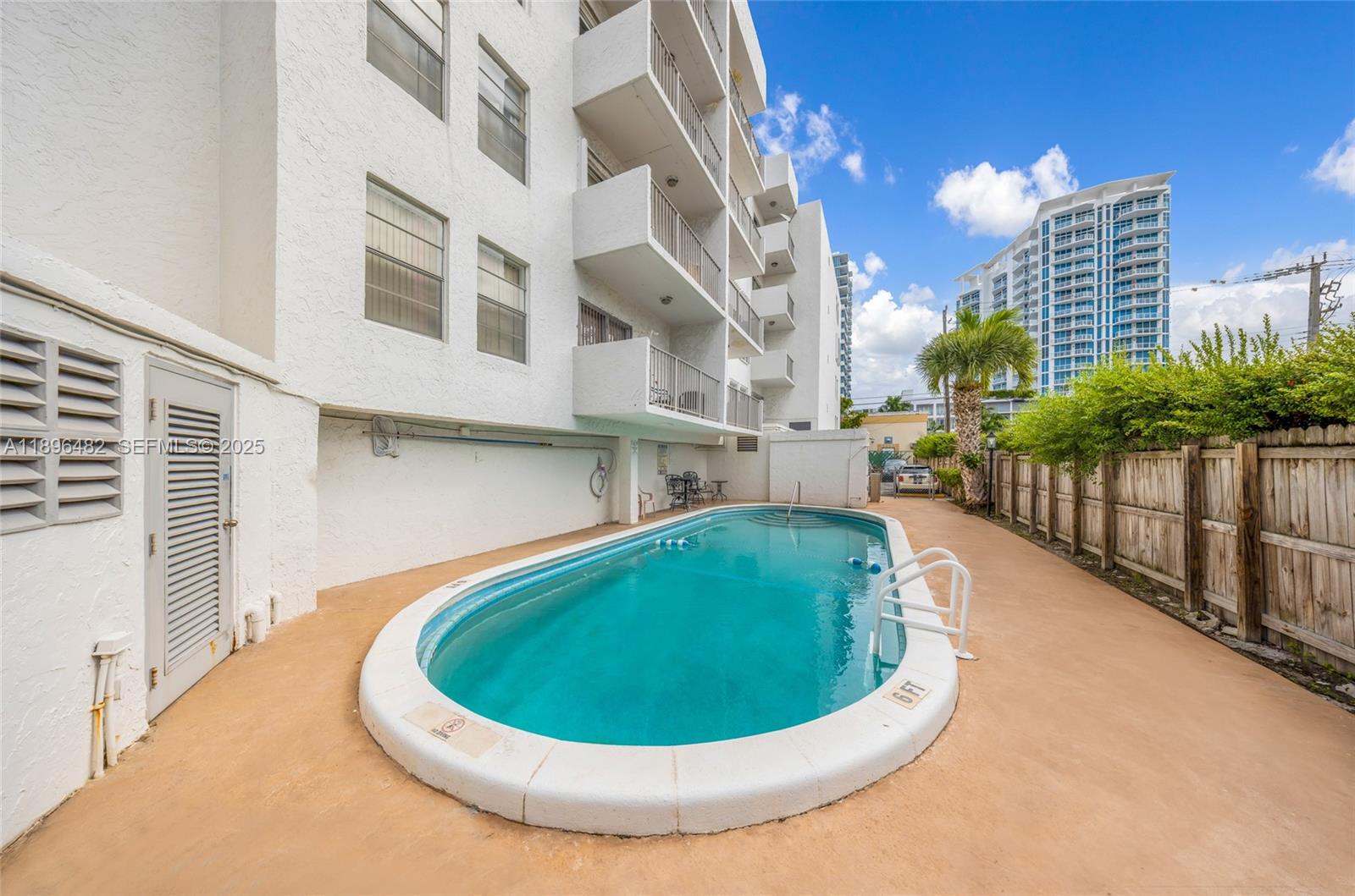 6545 Indian Creek Drive, Unit 504 Miami Beach, FL 33141 - Photo 26 of 38 a view of a swimming pool with a balcony