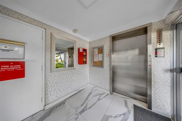 a view of a kitchen with sink washer and dryer