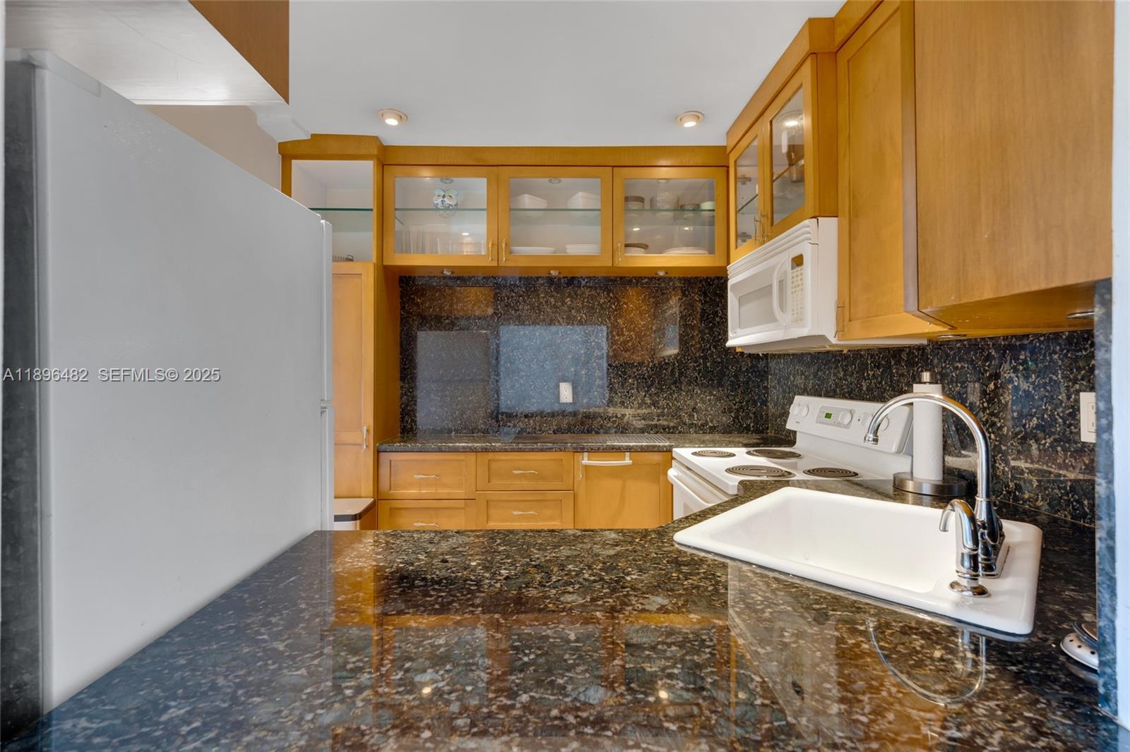 6545 Indian Creek Drive, Unit 504 Miami Beach, FL 33141 - Photo 32 of 38 a bathroom with a sink a bathtub and window