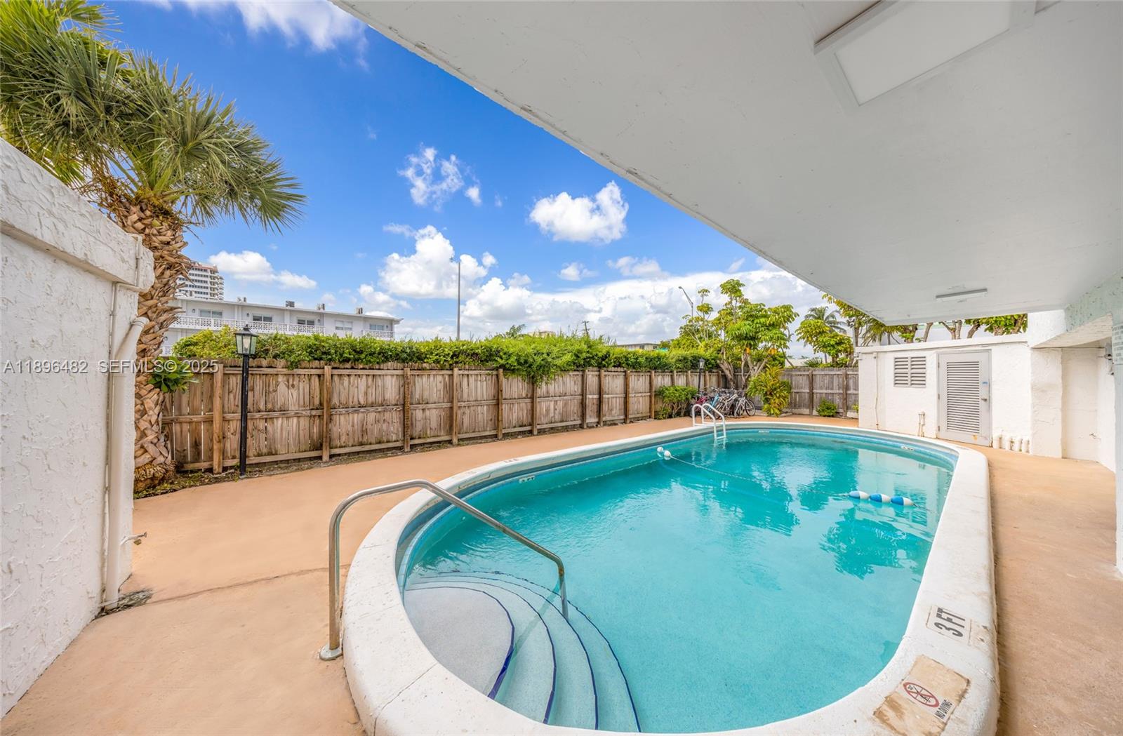 6545 Indian Creek Drive, Unit 504 Miami Beach, FL 33141 - Photo 35 of 38 a view of a swimming pool with an outdoor seating
