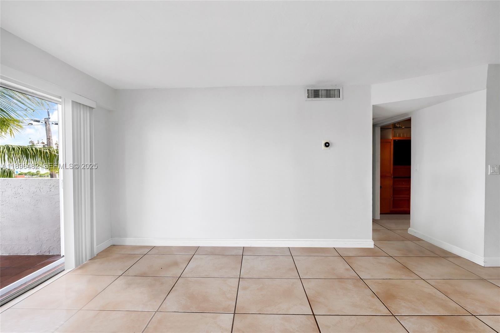 6545 Indian Creek Drive, Unit 504 Miami Beach, FL 33141 - Photo 6 of 38 an empty room with window