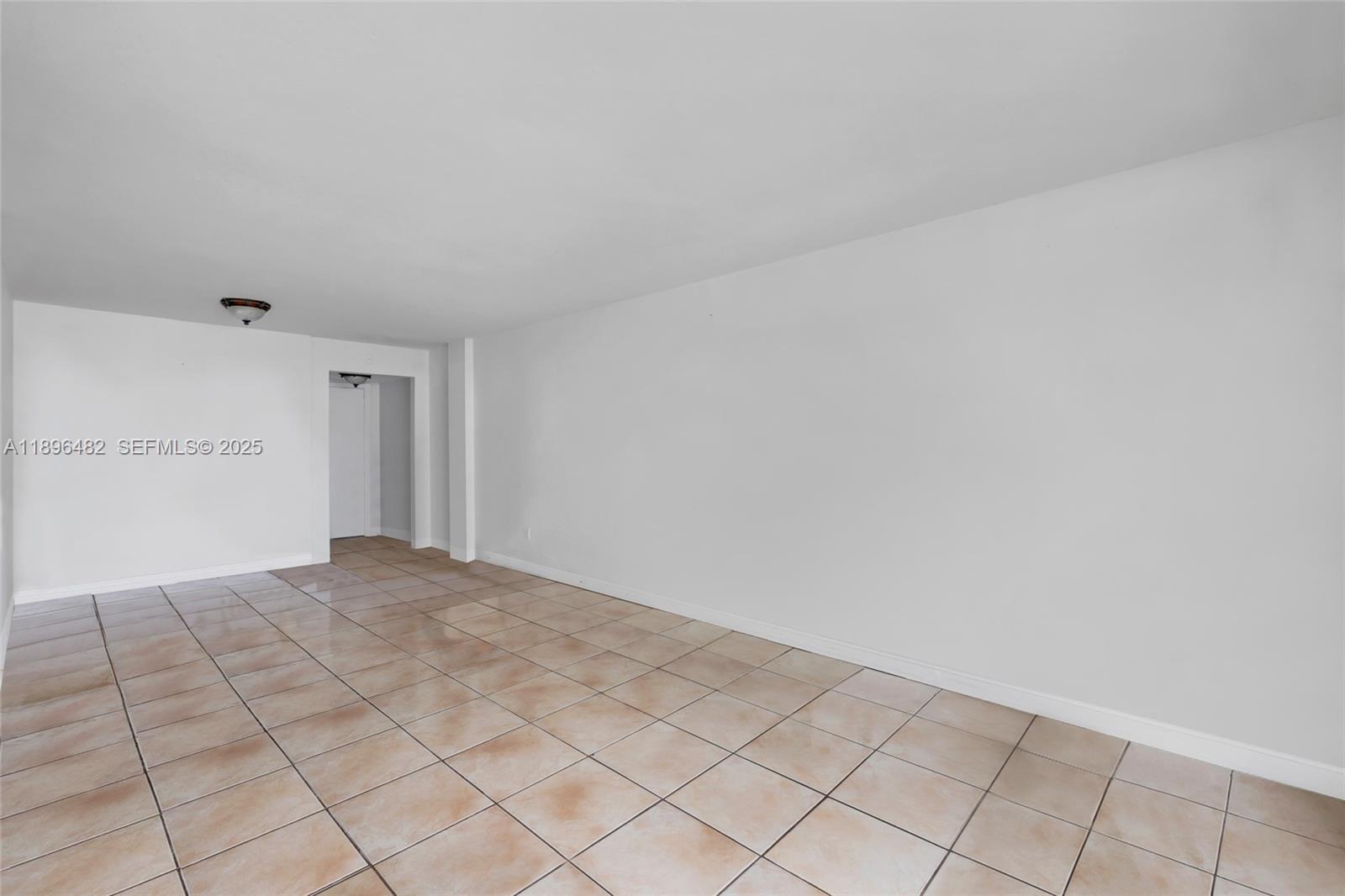 6545 Indian Creek Drive, Unit 504 Miami Beach, FL 33141 - Photo 7 of 38 a view of an empty room and window
