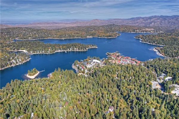 an aerial view of a house with a lake view
