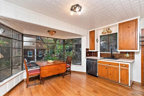 a dining room with a table and chairs