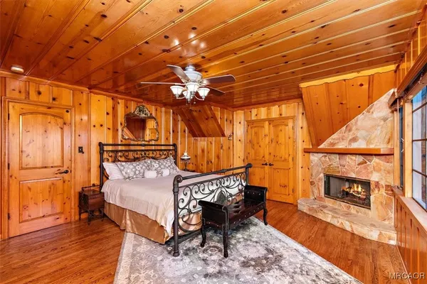 a bedroom with furniture and a large window