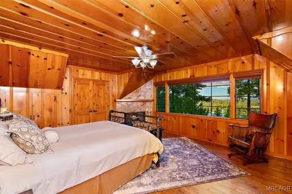 a bedroom with furniture and a window
