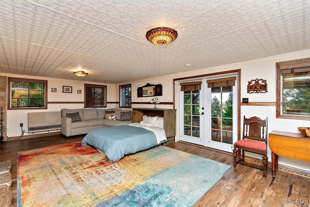 329 Summit Road Lake Arrowhead, CA 92352 - Photo 34 of 50 a bedroom with furniture and a large window