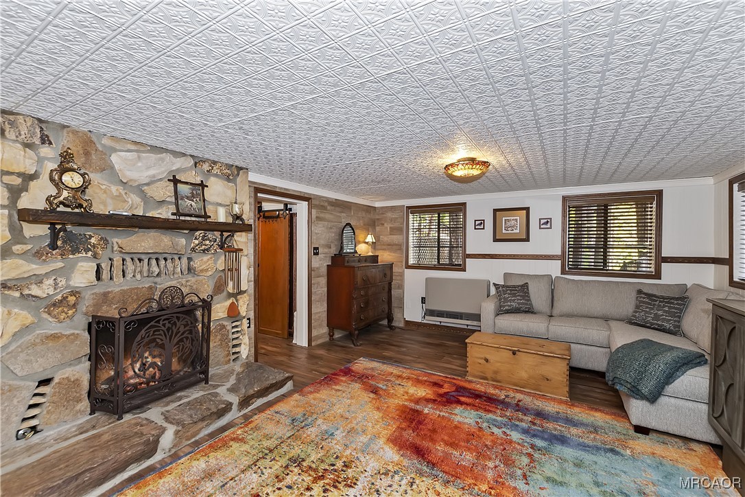 329 Summit Road Lake Arrowhead, CA 92352 - Photo 39 of 50 a living room with furniture and a fireplace