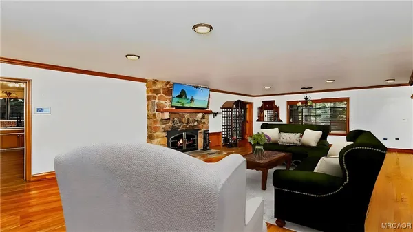 a view of a livingroom with furniture and windows