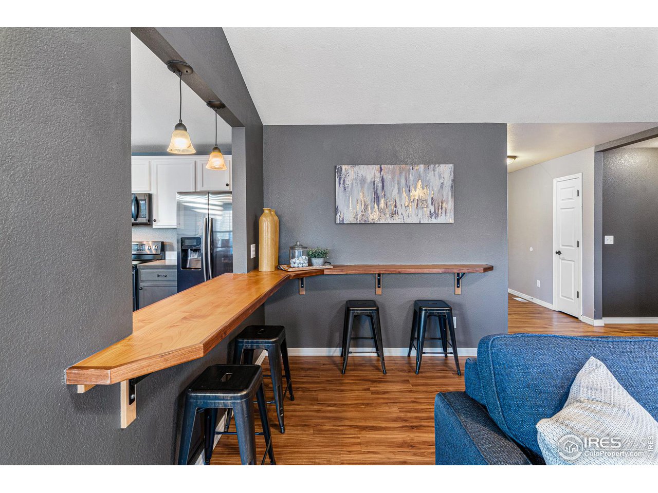 628 Sumac Street Frederick, CO 80530 - Photo 11 of 38 a view of a dining room with furniture and wooden floor