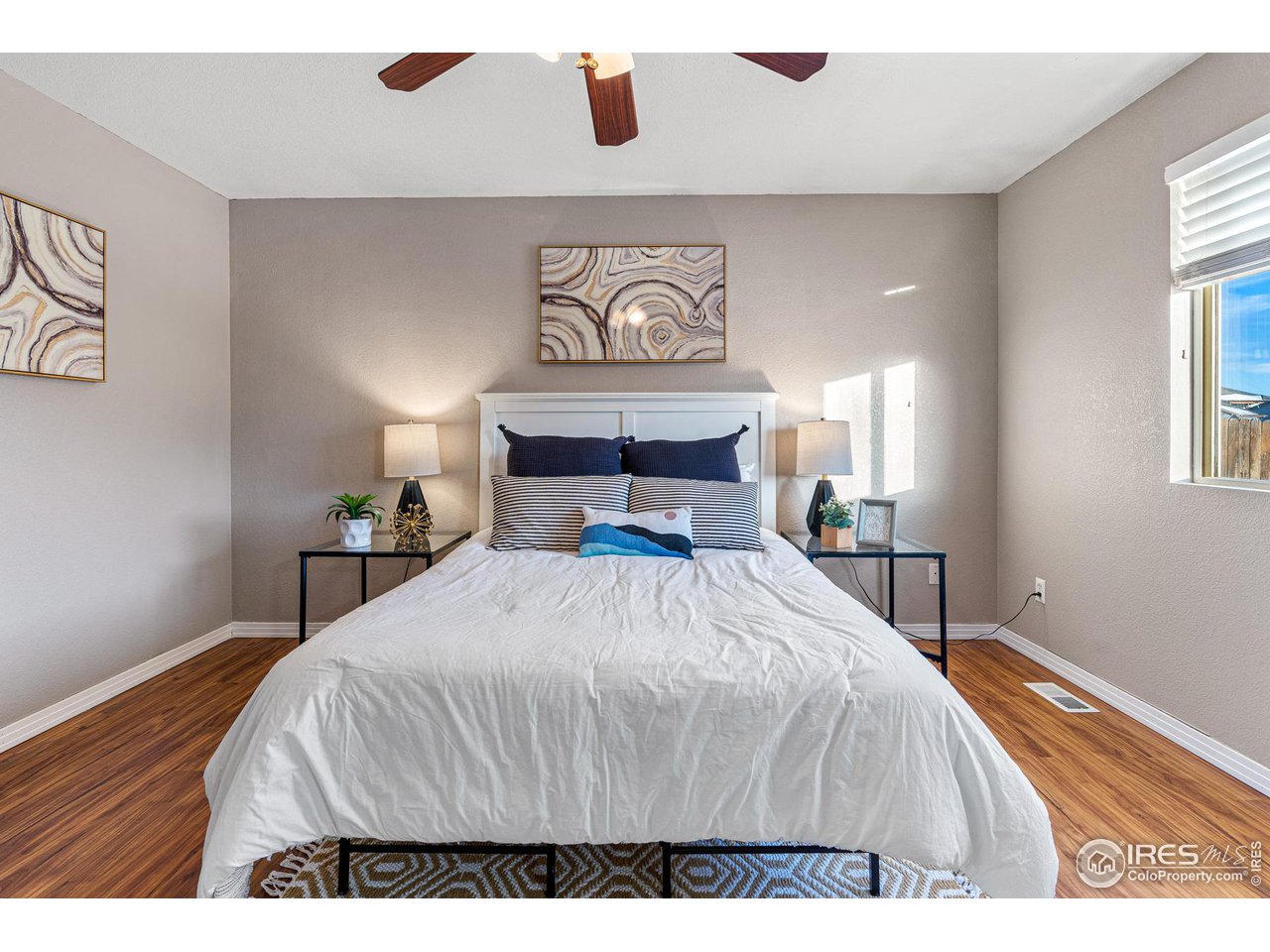 628 Sumac Street Frederick, CO 80530 - Photo 20 of 38 a bedroom with a bed and a window