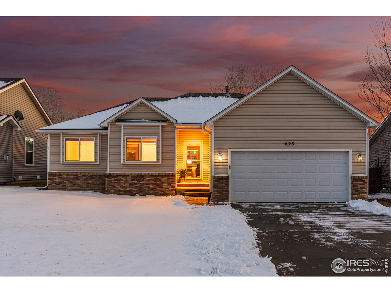 628 Sumac Street Frederick, CO 80530 - Photo 2 of 38 a front view of a house with a yard