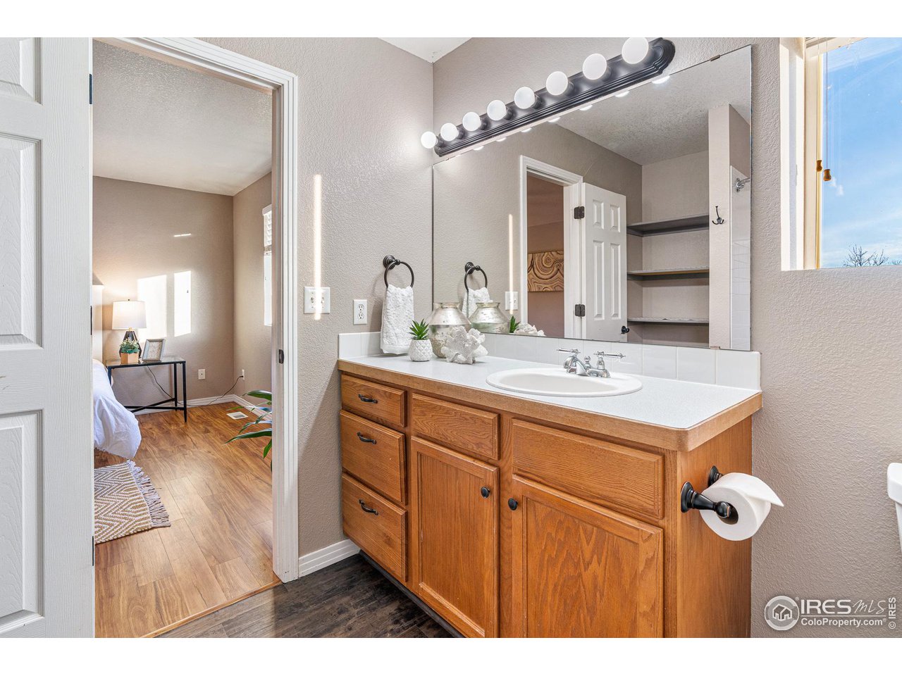 628 Sumac Street Frederick, CO 80530 - Photo 24 of 38 a bathroom with a sink double vanity and a mirror