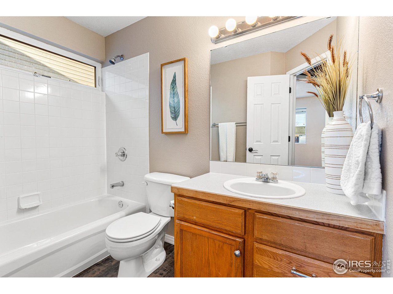 628 Sumac Street Frederick, CO 80530 - Photo 29 of 38 a bathroom with a sink a toilet and shower