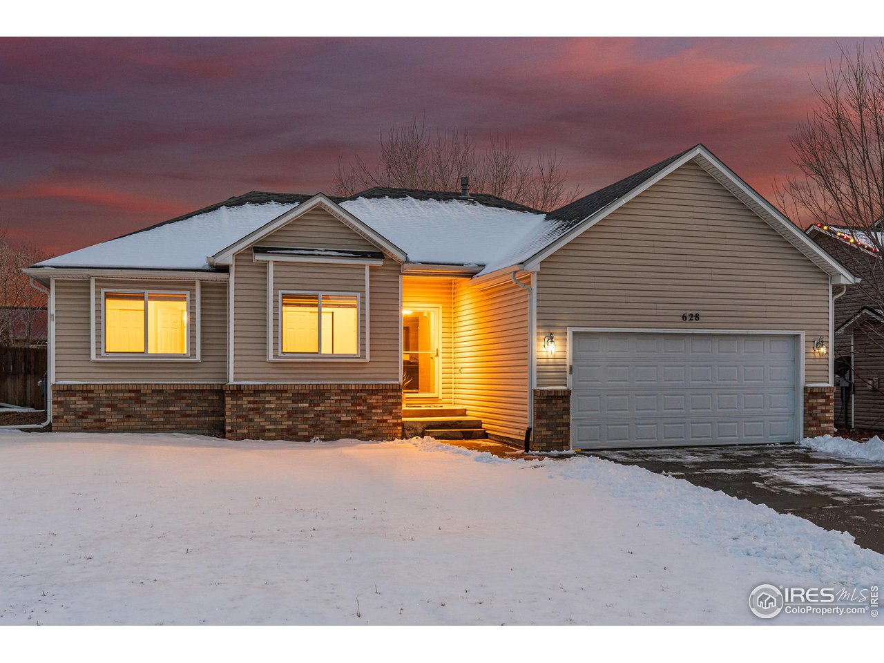 628 Sumac Street Frederick, CO 80530 - Photo 3 of 38 a front view of a house with a yard