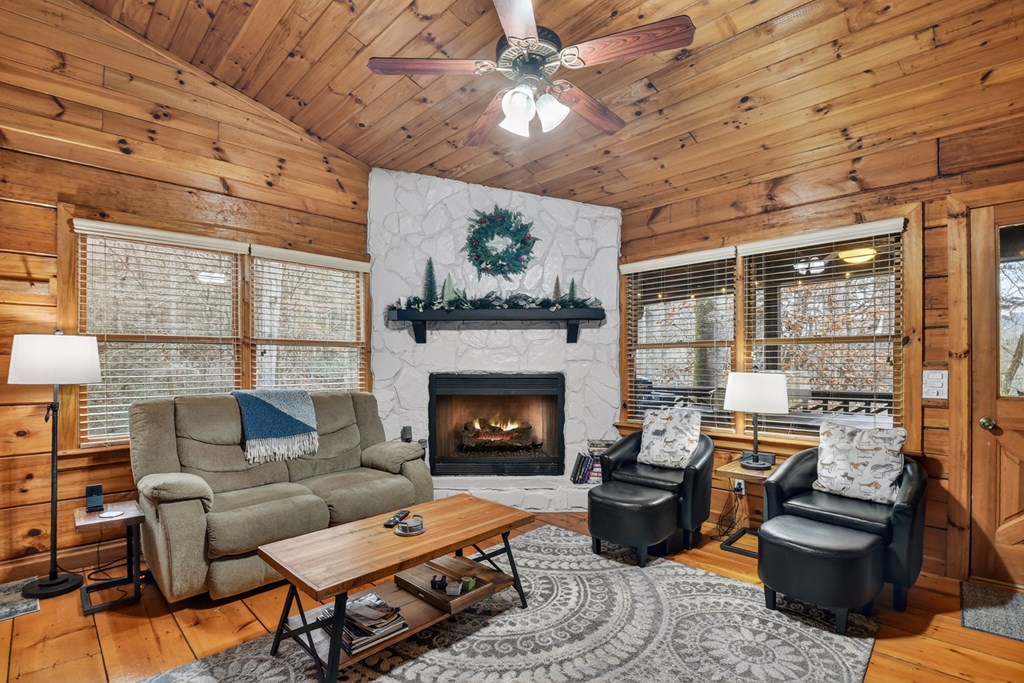488 Joann Sisson Road Blue Ridge, GA 30513 - Photo 16 of 39 a living room with furniture and a fireplace